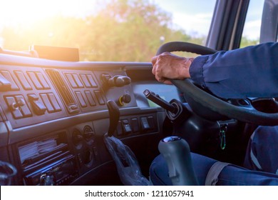 Truck Driver Keeps Driving With Hands,The Man Behind Semi Truck Steering Wheel.