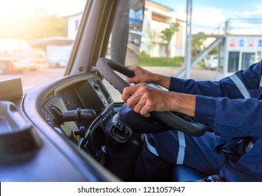 Truck Driver Keeps Driving With Hands,The Man Behind Semi Truck Steering Wheel.