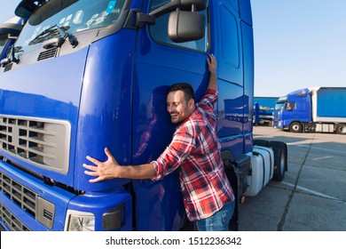 Truck Driver Loves His Job. Professional Trucker Driver Hugging His Truck Cabin Loving His Job.