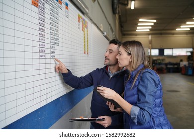 Truck Driver With Manager Checking Agenda