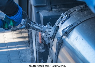 A Truck Driver Pulls The Tank Hose Out Of The LNG Tank After Refueling LNG