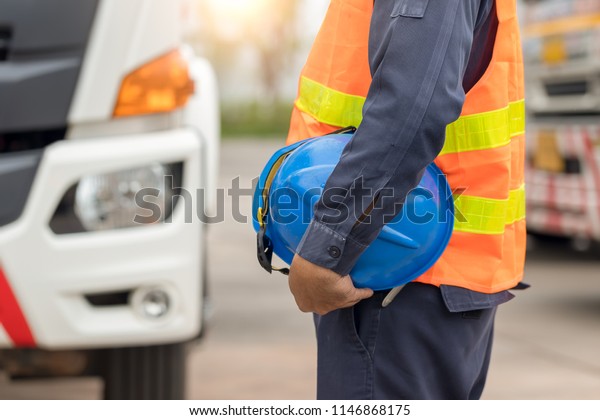 Truck driver safety hat\
holder,Performing a pre-trip inspection on a truck,Truck driver\
start trip.