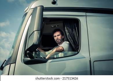 Truck Driver Sitting In Cab