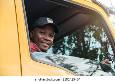 Truck Driver Smiling Confident In Insurance Cargo Lorry In Long Transportation And Delivery Business. Young African-American Man Training Driving Commercial Driver License At Truck Driving School.