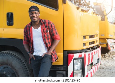 Truck Driver Smiling Confident In Insurance Cargo Lorry In Long Transportation And Delivery Business. Young African-American Man Training Driving Commercial Driver License At Truck Driving School.