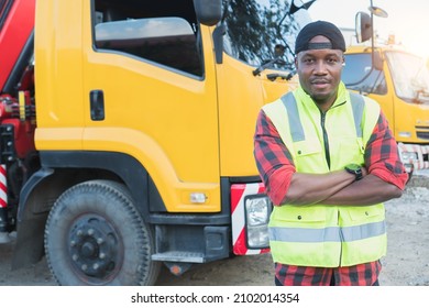 Truck Driver Smiling Confident In Insurance Cargo Lorry In Long Transportation And Delivery Business. Young African-American Man Training Driving Commercial Driver License At Truck Driving School.