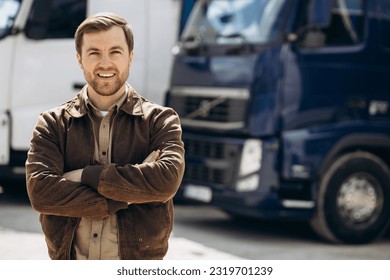 Truck driver standing by his lorry - Powered by Shutterstock