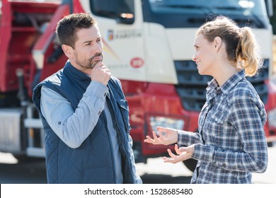 Truck Driver Talking To Shipment Supervisor