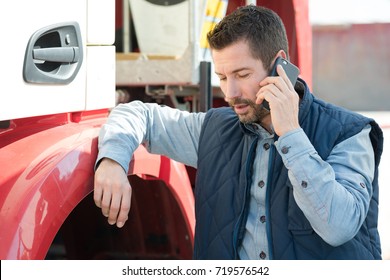 Truck Driver Tending A Client On The Phone