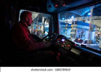 Truck Driver At Work. Driving At Night 