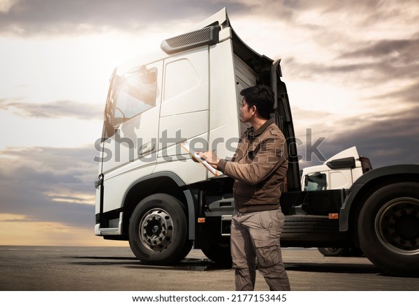 Truck\
Drivers Checking the Semi Truck\'s Maintenance Checklist. Inspection\
Safety Before Driving. Freight Truck\
Transport.	\
