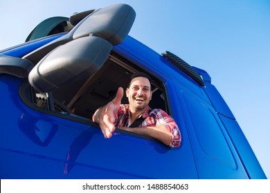 Truck drivers job openings. Truck driving careers. Middle aged professional trucker driver sitting in his vehicle cabin and giving a shaking hand to new recruits. Drivers wanted.