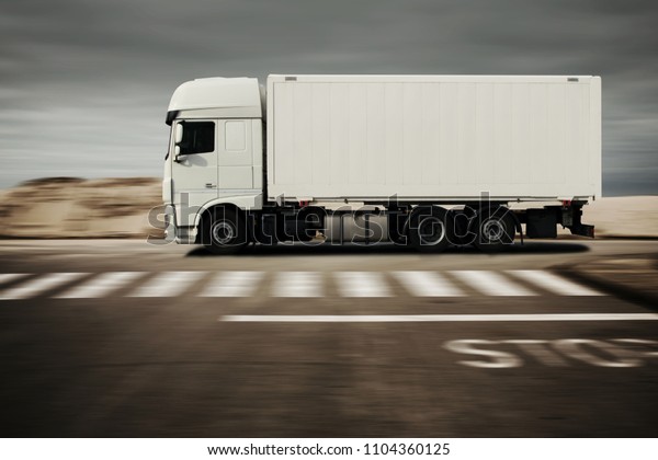 truck drives fast\
on a road through a\
desert