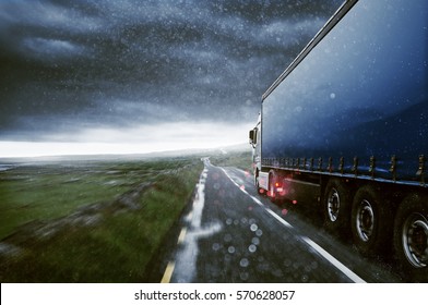 Truck drives through the rain