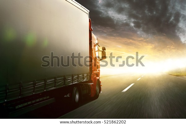 Truck driving into\
sunset