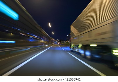 Truck driving on highway at night - Shutterstock ID 421583941