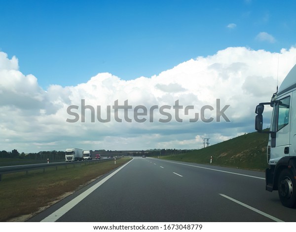 A truck driving on the highway in Poland.\
Transportation of heavy\
loads.