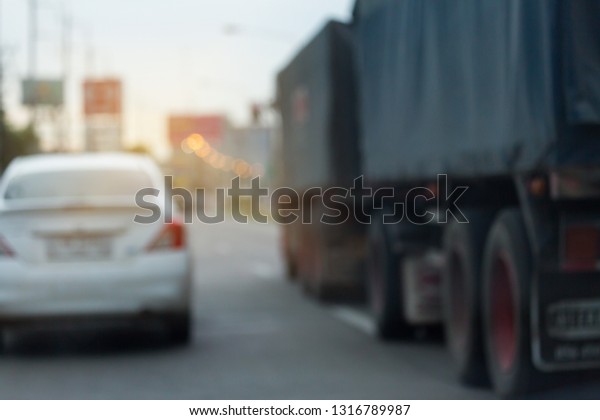 truck\
driving on urban road, image blur\
background
