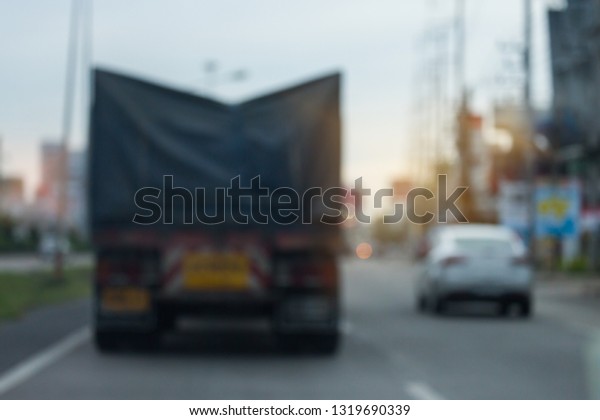 truck\
driving on urban road, image blur\
background