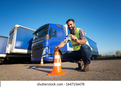 Truck Driving School And CDL Training. Driver Candidate Successfully Finished Truck Driving Training And Acquired Commercial Driving License. Transportation Business And Learning To Drive.