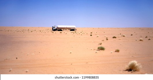 Truck Driving Through The Arab Desert Between Iraq And Jordan