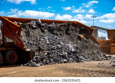 Truck Dumping Ore from Mine - Shutterstock ID 2365335421
