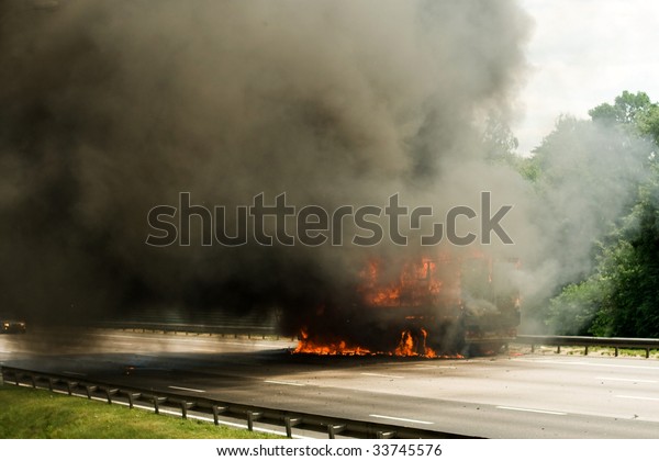 truck\
explosion on the road with a lot of fire and\
smoke