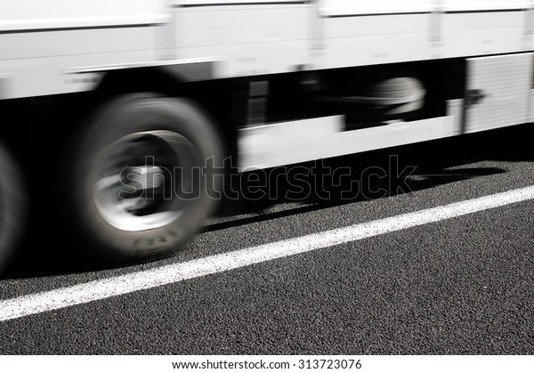 Truck\
for heavy transport activity in motion on\
highway