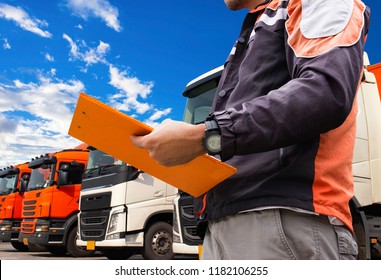 Truck Inspection Safety. Truck Driver Hand Holding Clipboard His Is Checking Semi Truck Trailer.