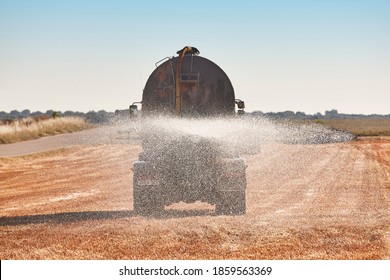 Truck Irrigating A Wheat Field With Fresh Water. Efficiency Agriculture