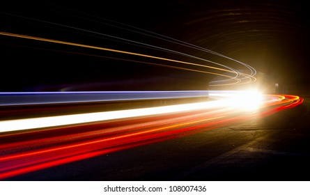 Truck light trails in tunnel. Art image . Long exposure photo taken in a tunnel - Shutterstock ID 108007436