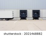 truck at loading ramps of a warehouse