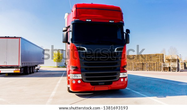 Truck\
logistics building . the red truck on the road\
