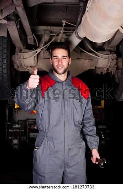 Truck mechanic thumbs up.\
