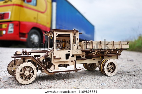 Truck model made of wood. This toy\
truck (35 cm long) made entirely of wood and without\
glue