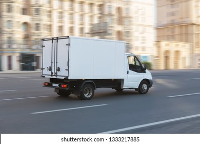 Truck Is Moving Down The Street In The City