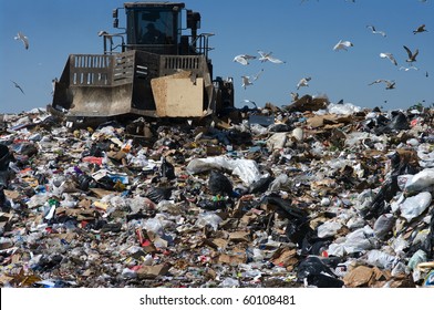 Truck moving trash in a landfill - Powered by Shutterstock