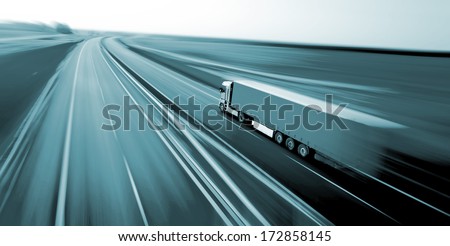 Truck on asphalt road motion blur 