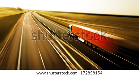 Truck on asphalt road motion blur 