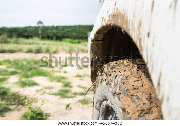 truck on a\
bad road, wheel so many mud in dirt\
road.