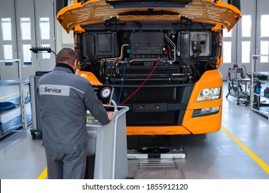 Truck On Computer Diagnostics In A Car Service. Service And Repair Of Trucks In A Large Garage. Car Service, Repair, Logistics And Transport.