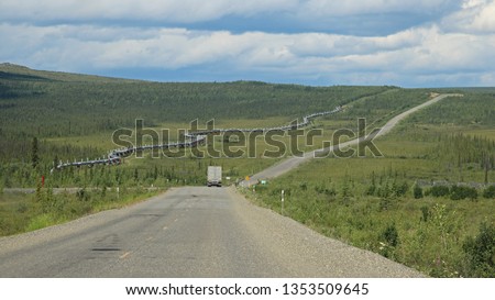 Truck on the Dalton Highway to the Alyeska Trans Alaska Pipeline (TAPS) and pipeline access road near the Arctic
