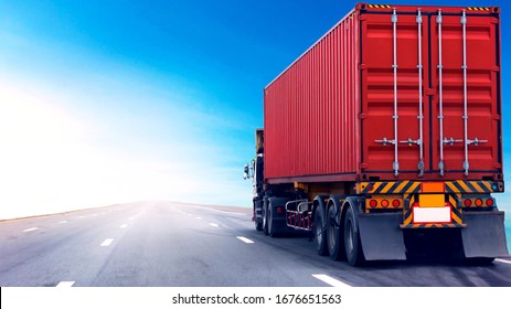 Truck on highway road with red container, transportation concept.,import,export logistic industrial Transporting Land transport on the asphalt expressway with blue sky