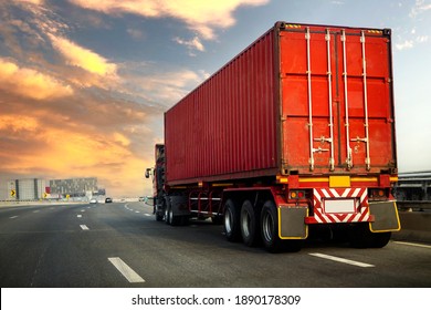 Truck on highway road with red container, transportation concept.,import,export logistic industrial Transporting Land transport on the asphalt expressway with sunrise sky.image motion blur
