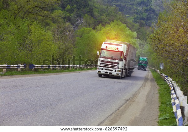 truck on highway road in\
sun lights
