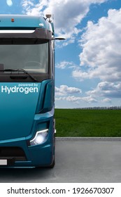 Truck On Hydrogen Fuel On A Background Of Green Field And Blue Sky