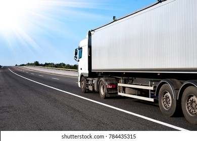 Truck on road with grey container, cargo transportation concept