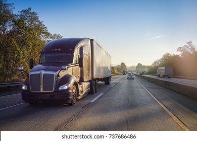 Truck on road at sunrise