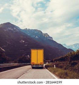 Truck On The Road.  Yellow Cargo Car