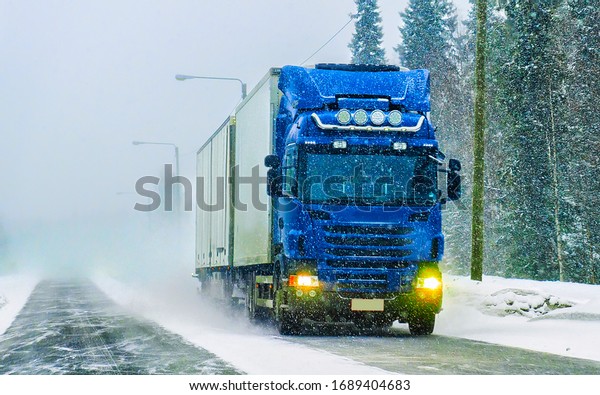 Truck on\
the Snow Road in winter Lapland in\
Finland.